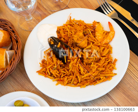 Pasta with seafood contains tiger prawns, shell mussels, spices and chicken fillet Pasta with seafood contains tiger prawns, shell mussels, spices and chicken fillet 138100663