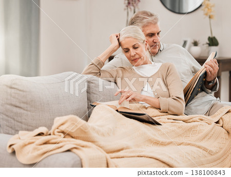 Old couple on couch, reading book and relax together at home, retirement and wellness with love and comfort. Trust, care and support in marriage, share hobby with partner for knowledge and story Old couple on couch, reading book and relax together at home, retirement and wellness with love and comfort. Trust, care and support in marriage, share hobby with partner for knowledge and story 138100843