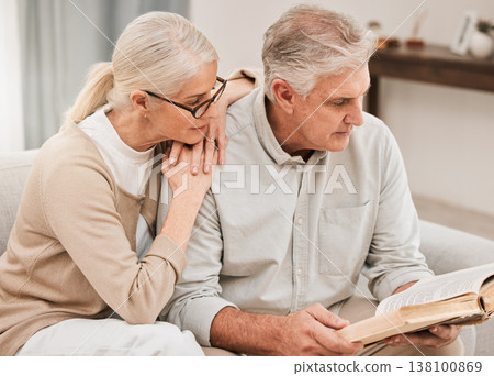 Bible study, faith and senior couple with a book in a living room relax, reading and bond at home. God, Worship and retired elderly people with scripture, guidance or gospel, love and Jesus praise Bible study, faith and senior couple with a book in a living room relax, reading and bond at home. God, Worship and retired elderly people with scripture, guidance or gospel, love and Jesus praise 138100869