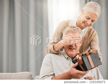Old couple, present for birthday and surprise with celebration, man and woman at home with love and grand gesture. Gift box for special event, marriage and relationship with anniversary and romance 138100873