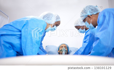Patient, hospital and surgeon team with bed for emergency, healthcare or medical procedure. Doctors with a man to start collaboration, healing or surgery and operation with support and scrubs in ICU Patient, hospital and surgeon team with bed for emergency, healthcare or medical procedure. Doctors with a man to start collaboration, healing or surgery and operation with support and scrubs in ICU 138101129