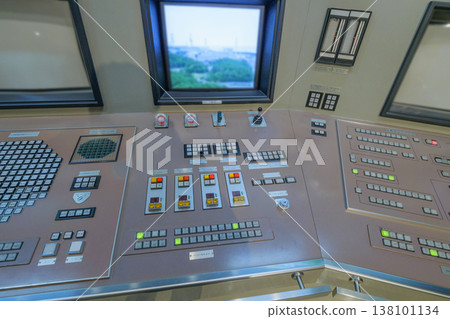 Control console in the central control room of a nuclear power plant Control console in the central control room of a nuclear power plant 138101134