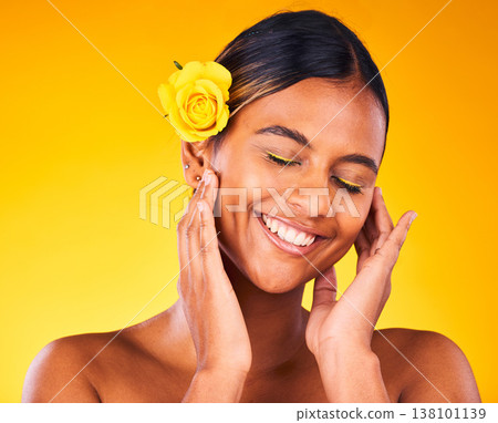 Cosmetic, flower and young woman in studio with beauty, glow and skincare face routine. Makeup, rose and female model from Mexico with facial dermatology treatment isolated by yellow background. Cosmetic, flower and young woman in studio with beauty, glow and skincare face routine. Makeup, rose and female model from Mexico with facial dermatology treatment isolated by yellow background. 138101139