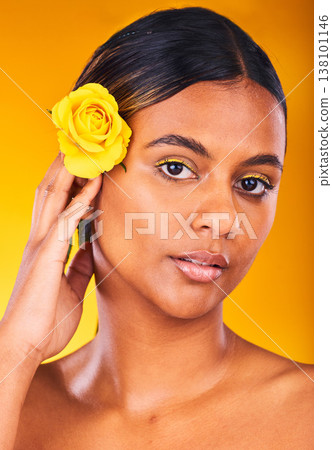 Skincare, flower and portrait of woman in studio with beauty, glow and cosmetic face routine. Makeup, rose and young female model from Mexico with facial treatment isolated by yellow background. 138101146