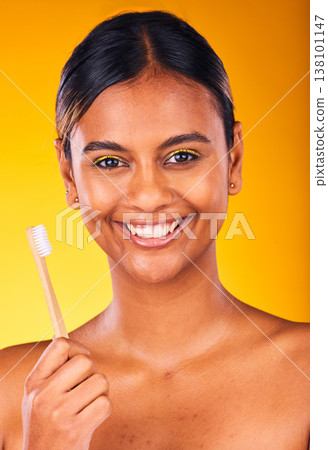 Woman, smile and portrait for dental, toothbrush and teeth for health, happy and hygiene by studio background. Person, treatment and whitening or clean, oral and brushing teeth for wellness in mouth 138101147