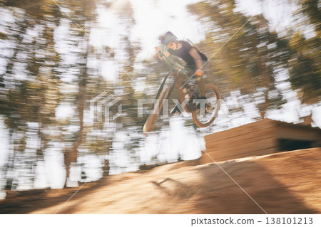Motion blur, mountain bike and cycling, man with speed for extreme sports and training in fast adventure. Professional dirt race action, off road bicycle competition or performance challenge in woods Motion blur, mountain bike and cycling, man with speed for extreme sports and training in fast adventure. Professional dirt race action, off road bicycle competition or performance challenge in woods 138101213
