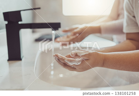 Bathroom, water and child cleaning hands with soap, foam or learning healthy hygiene together. Washing dirt, germs or bacteria on fingers, kid in home in morning for wellness, safety or skin care. 138101258