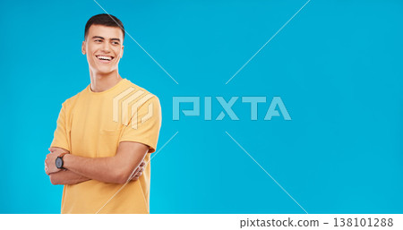 Smile, crossed arms and man in a studio with mockup space for advertising, promotion or marketing. Happy, confidence and young male model from Canada with mock up isolated by blue background. Smile, crossed arms and man in a studio with mockup space for advertising, promotion or marketing. Happy, confidence and young male model from Canada with mock up isolated by blue background. 138101288