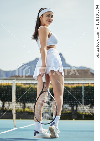 Woman, smile on tennis court and fitness, sports game and athlete with racket for performance and competition. Health, ready for match and professional player on outdoor turf, exercise and mission 138101504