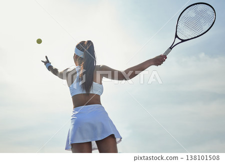 Woman, tennis and serving with fitness on court and start game, sports and athlete, performance and competition. Health, energy and professional player on outdoor turf, back low angle and racket Woman, tennis and serving with fitness on court and start game, sports and athlete, performance and competition. Health, energy and professional player on outdoor turf, back low angle and racket 138101508