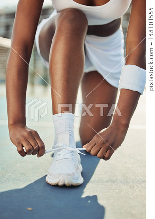 Woman, shoes and tying laces on tennis court getting ready for sports match, game or outdoor practice. Closeup of female person tie shoe in preparation for fitness, exercise or training workout 138101555