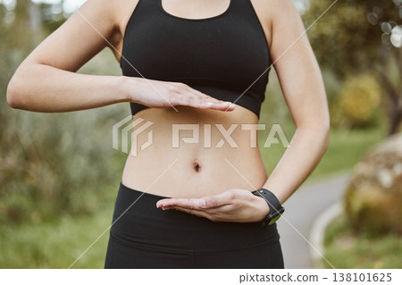 Woman, hands and stomach in nature for lose weight, tai chi or spiritual wellness in outdoor exercise. Closeup of female person and abdomen for reiki, aura or balance in body care, fitness or park Woman, hands and stomach in nature for lose weight, tai chi or spiritual wellness in outdoor exercise. Closeup of female person and abdomen for reiki, aura or balance in body care, fitness or park 138101625
