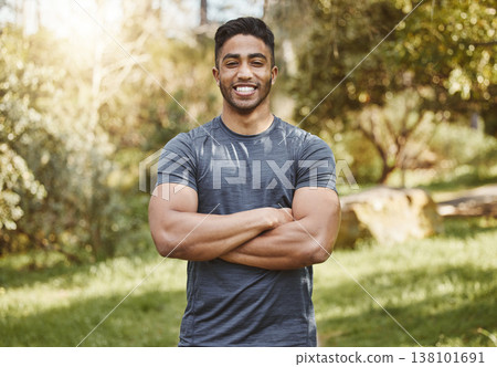 Happy, fitness and portrait of man with arms crossed in a park for workout, running or wellness. Exercise, face and Indian male runner smile in a forest for training, cardio and positive mindset 138101691