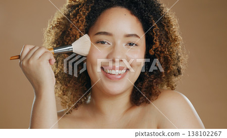 Makeup, portrait or foundation by happy woman with brush in studio for beauty or wellness on brown background. Makeover, glamour or biracial girl model relax with cosmetics powder or application tool Makeup, portrait or foundation by happy woman with brush in studio for beauty or wellness on brown background. Makeover, glamour or biracial girl model relax with cosmetics powder or application tool 138102267