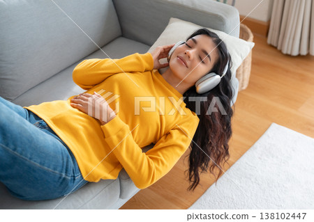 Portrait of Asian woman relaxing listening audio with headphones 138102447