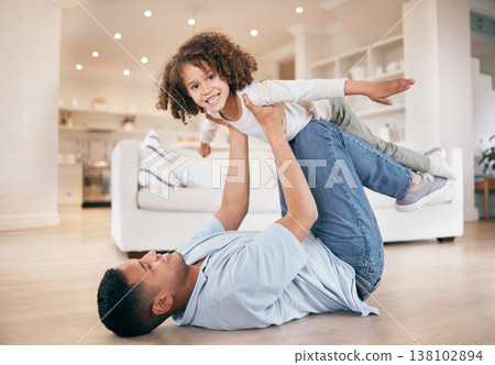 Father, kid and airplane game on floor, smile and portrait with support, home and care in a living room. Family, dad and child playing, fly and bonding with love, relax and happiness on weekend break 138102894