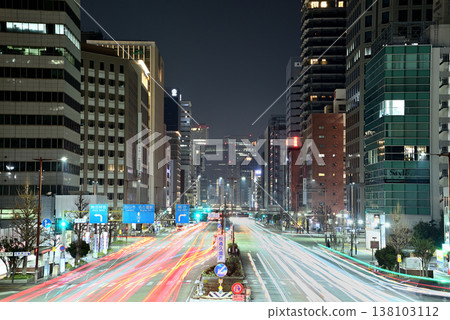 A striking urban night view of Nagoya, featuring the city's skyscrapers and the light trails of cars driving along the main street (Part 2) 138103112