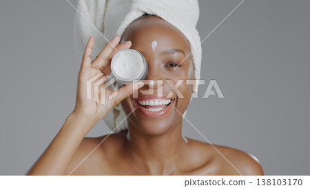 Black woman, portrait and beauty with skincare, cream for face with natural cosmetics on grey background. Lotion, dermatology and African model with smile, moisturizer and treatment in studio Black woman, portrait and beauty with skincare, cream for face with natural cosmetics on grey background. Lotion, dermatology and African model with smile, moisturizer and treatment in studio 138103170