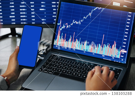 Person, hands and phone mockup for stock market trading or finance statistics of data, graph or chart at office. Closeup of employee, broker or financial advisor on smartphone and laptop in marketing Person, hands and phone mockup for stock market trading or finance statistics of data, graph or chart at office. Closeup of employee, broker or financial advisor on smartphone and laptop in marketing 138103288