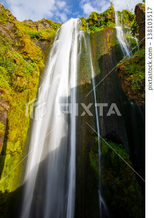 The Republic of Iceland, a Nordic island nation, is home to the Grøblauj waterfall, which cascades into a rocky cave deep within Seljalandsfoss. The Republic of Iceland, a Nordic island nation, is home to the Grøblauj waterfall, which cascades into a rocky cave deep within Seljalandsfoss. 138103517