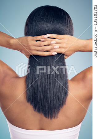 Beauty, hair and hands with a woman from the back in studio on a gray background for shampoo treatment. Keratin, spa or salon for haircare and a model closeup with natural and aesthetic growth Beauty, hair and hands with a woman from the back in studio on a gray background for shampoo treatment. Keratin, spa or salon for haircare and a model closeup with natural and aesthetic growth 138103702