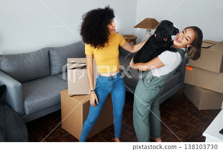Dog, smile and gay couple in new home, play and bonding together in living room. Happy lesbian women with pet in house, apartment and moving in to real estate property, having fun and carrying animal Dog, smile and gay couple in new home, play and bonding together in living room. Happy lesbian women with pet in house, apartment and moving in to real estate property, having fun and carrying animal 138103730