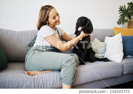 Care, love and woman with dog in home sofa to relax and play with animal. Pet owner, happy and asian person on floor with companion, smile and wellness or friendship and together in cozy apartment Care, love and woman with dog in home sofa to relax and play with animal. Pet owner, happy and asian person on floor with companion, smile and wellness or friendship and together in cozy apartment 138103755