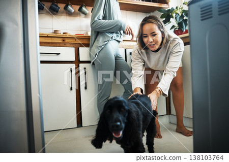 Love, dog and happy with lesbian couple in kitchen for relax, support and care. Canine animal, morning and smile with gay women and pet puppy at home for bonding, playful and happiness together Love, dog and happy with lesbian couple in kitchen for relax, support and care. Canine animal, morning and smile with gay women and pet puppy at home for bonding, playful and happiness together 138103764