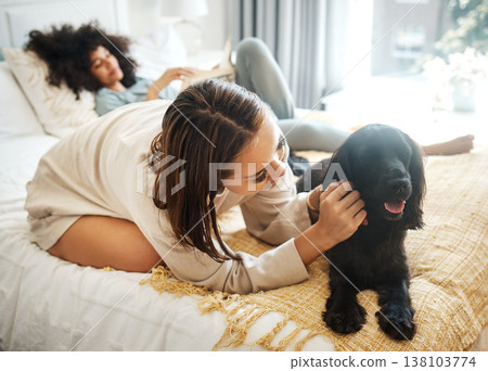 Dog, bedroom and lesbian couple playing in home, morning and relax together in house. Pet, bed and gay women with animal, bonding and having fun in healthy relationship, love connection and care. Dog, bedroom and lesbian couple playing in home, morning and relax together in house. Pet, bed and gay women with animal, bonding and having fun in healthy relationship, love connection and care. 138103774