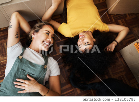 Top view, lesbian and couple with boxes, homeowners and achievement with love, bonding and property. Queer people, lgbtq or happy women on the ground, new apartment and conversation with real estate Top view, lesbian and couple with boxes, homeowners and achievement with love, bonding and property. Queer people, lgbtq or happy women on the ground, new apartment and conversation with real estate 138103795