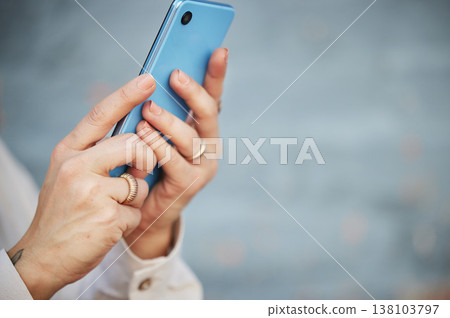 Hands, phone and space with a person closeup on a blurred gray background for social media, communication or networking. Mobile, contact and app with an adult typing or reading a text message Hands, phone and space with a person closeup on a blurred gray background for social media, communication or networking. Mobile, contact and app with an adult typing or reading a text message 138103797