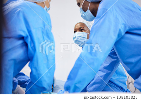 Doctors, hospital and surgeon team in theatre and emergency, healthcare or medical procedure. Group or staff with collaboration, healing or surgery and operation with support and scrubs in ICU Doctors, hospital and surgeon team in theatre and emergency, healthcare or medical procedure. Group or staff with collaboration, healing or surgery and operation with support and scrubs in ICU 138103823