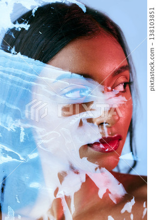 Plastic, beauty and woman with makeup, creativity and wellness on a blue studio background. Person, model and girl with art, luxury or skincare with cosmetics, dermatology and grooming with aesthetic Plastic, beauty and woman with makeup, creativity and wellness on a blue studio background. Person, model and girl with art, luxury or skincare with cosmetics, dermatology and grooming with aesthetic 138103851