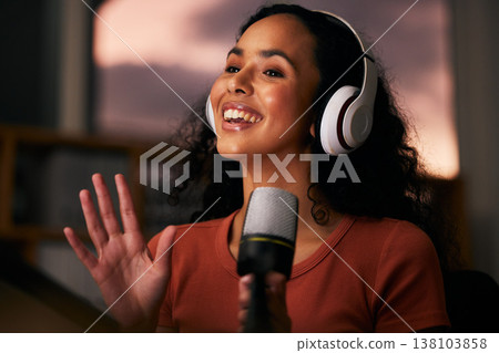 Woman, headphones and microphone, radio talk show and podcast, press journalist and live broadcast at night. Happy, tech and multimedia, communication and social media streamer with content creation 138103858
