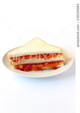 Peanut butter and jelly sandwich on a white background Peanut butter and jelly sandwich on a white background 138104064