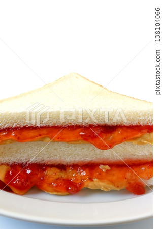 Peanut butter and jelly sandwich on a white background Peanut butter and jelly sandwich on a white background 138104066