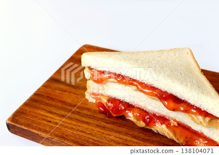Peanut butter and jelly sandwich on a white background Peanut butter and jelly sandwich on a white background 138104071