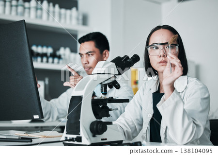 Scientist, woman and analysis of cannabis in laboratory for science study, marijuana review or medical research. Cbd, person and weed bud check for scientific experiment with microscope and focus Scientist, woman and analysis of cannabis in laboratory for science study, marijuana review or medical research. Cbd, person and weed bud check for scientific experiment with microscope and focus 138104095