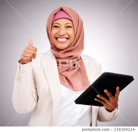 Business woman, thumbs up and tablet for success, like and subscribe to human resources website in studio. Portrait of muslim employee in dubai on digital tech, HR job support and awhite background Business woman, thumbs up and tablet for success, like and subscribe to human resources website in studio. Portrait of muslim employee in dubai on digital tech, HR job support and awhite background 138104224