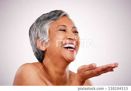 Skincare face, mature woman and laugh at funny anti aging treatment, self care shine or morning skin routine, hygiene or grooming. Studio comedy, makeup palm gesture and person on white background 138104313