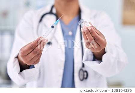 Hands, doctor with needle and vaccine bottle for healthcare, safety from virus and medicine in hospital. Pharmaceutical drugs, person has container and syringe for immunity with health and wellness Hands, doctor with needle and vaccine bottle for healthcare, safety from virus and medicine in hospital. Pharmaceutical drugs, person has container and syringe for immunity with health and wellness 138104326