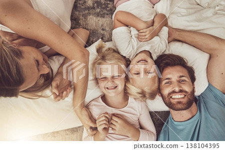 Happy family, children and parents in bedroom, morning and smile with tickle, play or fun. Bed, laugh and funny with mom, dad or girls in bedroom, home or bonding in top view, playful or affectionate 138104395