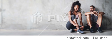 Couple, fitness and happy by banner on break, active and health or wellness. Positive people, smile and exercise by training, gym and space on gray background, performance and cardio workout at wall Couple, fitness and happy by banner on break, active and health or wellness. Positive people, smile and exercise by training, gym and space on gray background, performance and cardio workout at wall 138104430