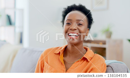 Portrait, funny and a black woman laughing on a sofa in the living room of her home to relax on the weekend. Face, smile and comedy with a happy young person in her apartment to joke for humor 138104535