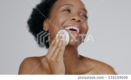 Face, model and hands for beauty with cleanser, cotton sponge and cosmetic in gray background studio. Black woman, healthy skin and dermatology with self care, facial and skincare aesthetic in mockup Face, model and hands for beauty with cleanser, cotton sponge and cosmetic in gray background studio. Black woman, healthy skin and dermatology with self care, facial and skincare aesthetic in mockup 138104606