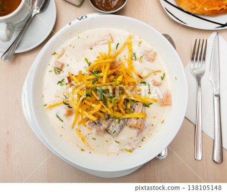 Latin American peanut soup sopa de mani with empanada 138105148