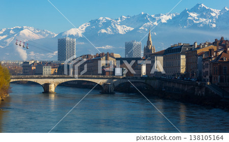 Cityscape of Grenoble with cable car and snowy Alps 138105164