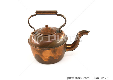 Vintage copper teapot with a curved handle and spout, isolated on white Vintage copper teapot with a curved handle and spout, isolated on white 138105780