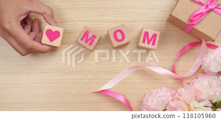 Mother's Day gift arrangement with blocks spelling 'Mom' 138105960