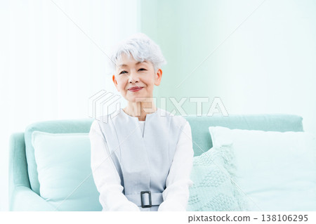 A senior woman thinking in the living room 138106295